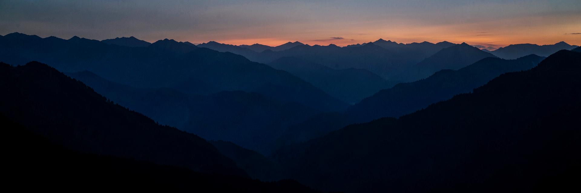 Layered mountain ridges at dusk